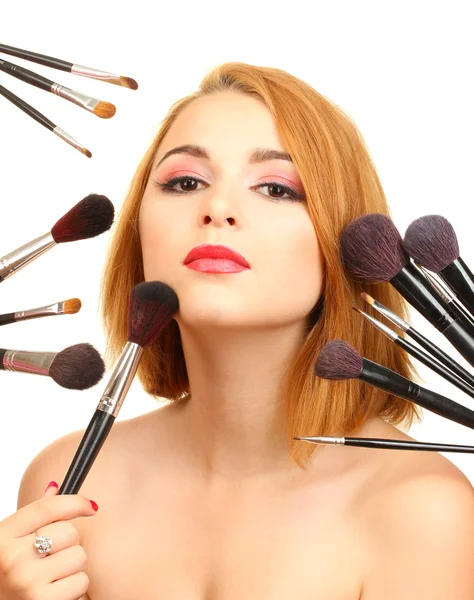 Portrait of beautiful woman with make-up brushes — Stock Photo, Image