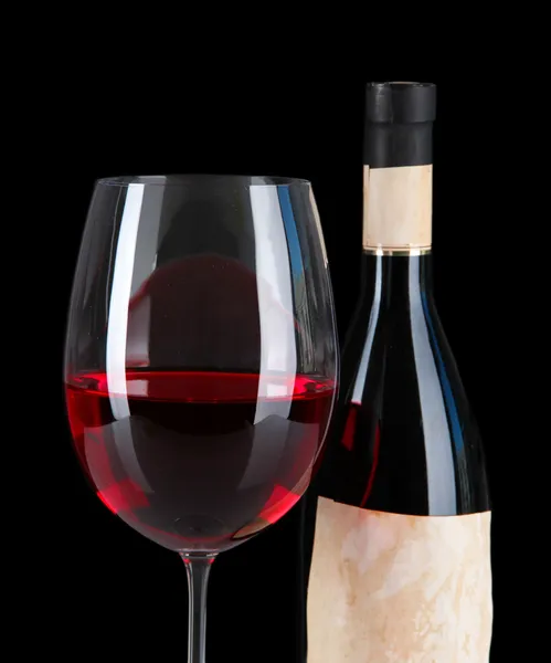 Glass of wine with bottle on bright background — Stock Photo, Image