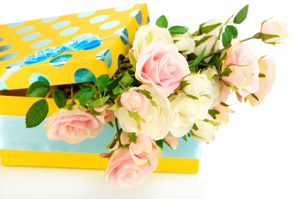 Yellow gift box with flowers isolated on white