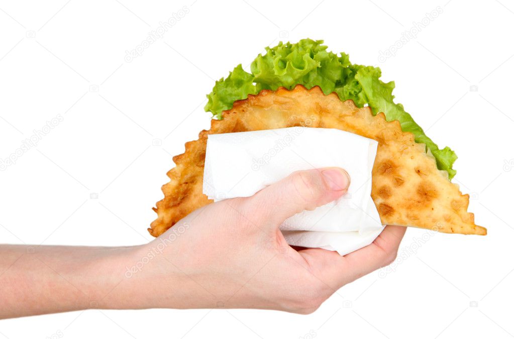 Hand holding tasty cheburek, isolated on white