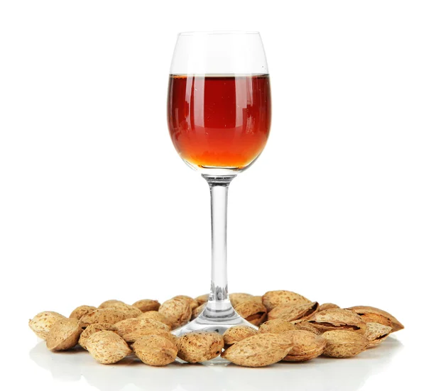 Glass of amaretto liquor and roasted almonds, isolated on white — Stock Photo, Image