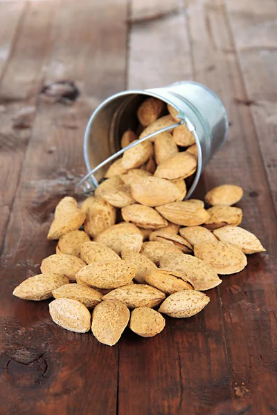 Almond on wooden background — Stock Photo, Image