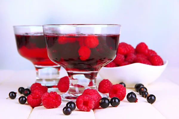 Jelly with fresh berries on wooden table — Stock Photo, Image