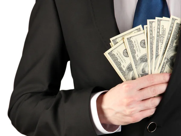 Business man hiding money in pocket on grey background — Stock Photo, Image