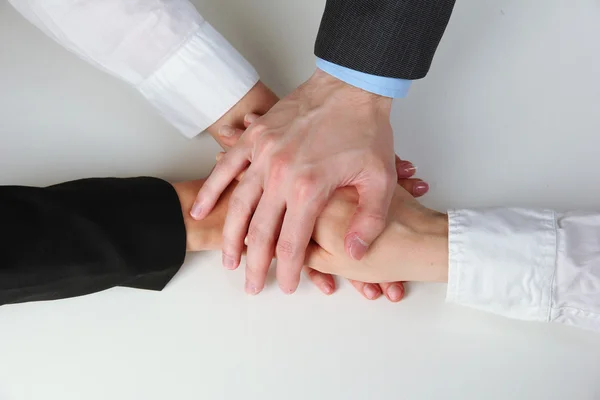 Group of young people's hands isolated on white — Stock Photo, Image