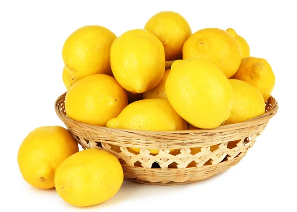 Ripe lemons in wicker basket isolated on white — Stock Photo, Image