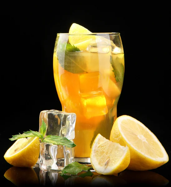 Iced tea with lemon and mint on black background — Stock Photo, Image