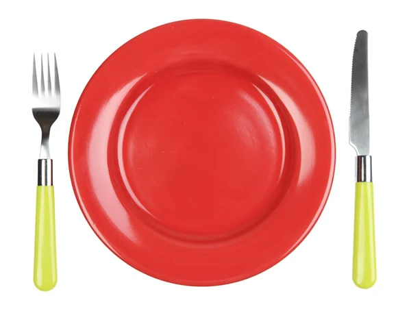 Cuchillo, placa de color y tenedor, aislado en blanco — Foto de Stock