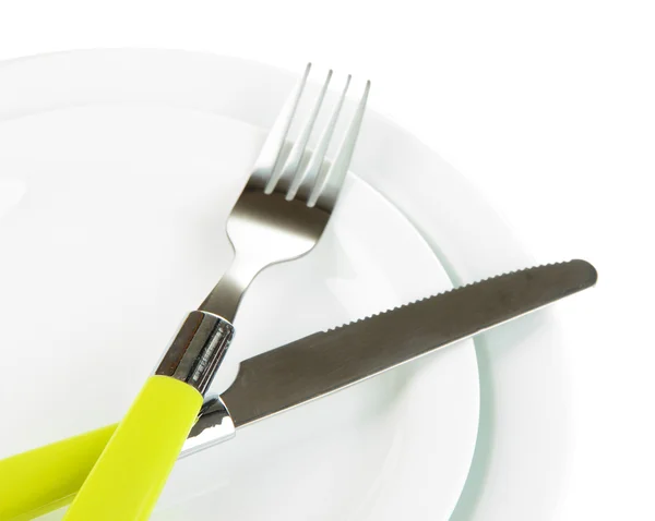 Coltello, piastra di colore e forchetta, isolato su bianco — Foto Stock