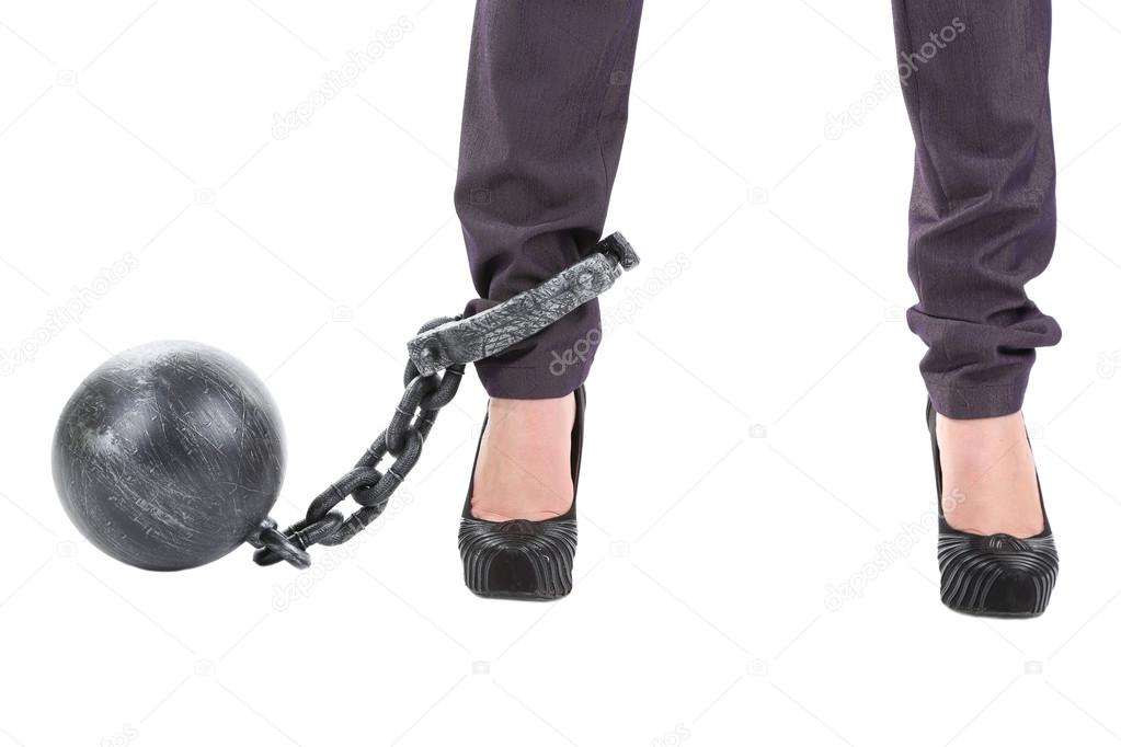 Business worker with ball and chain attached to foot isolated on white