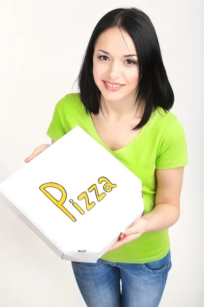 Hermosa chica con pizza en caja de pizza aislada en blanco —  Fotos de Stock