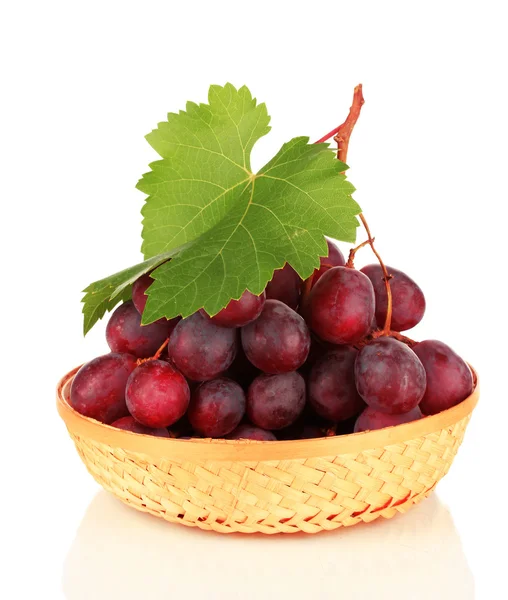 Ripe delicious grapes in wicker basket isolated on white — Stock Photo, Image