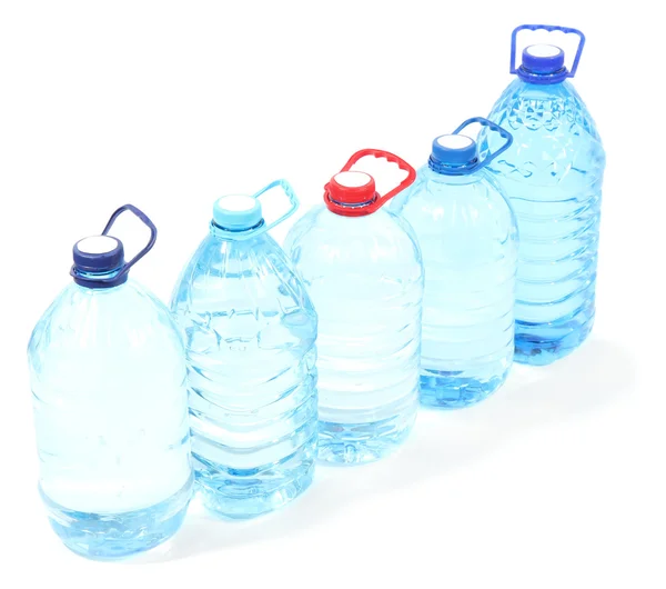 Agua en grandes botellas aisladas en blanco — Foto de Stock