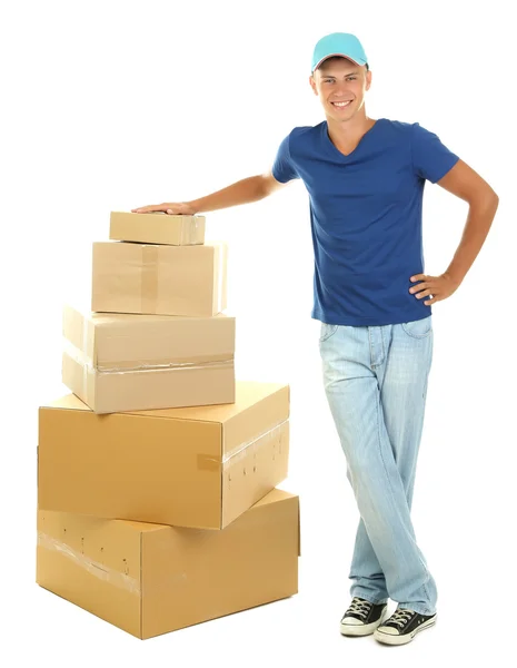 Young delivery man with parcels, isolated on white — Stock Photo, Image