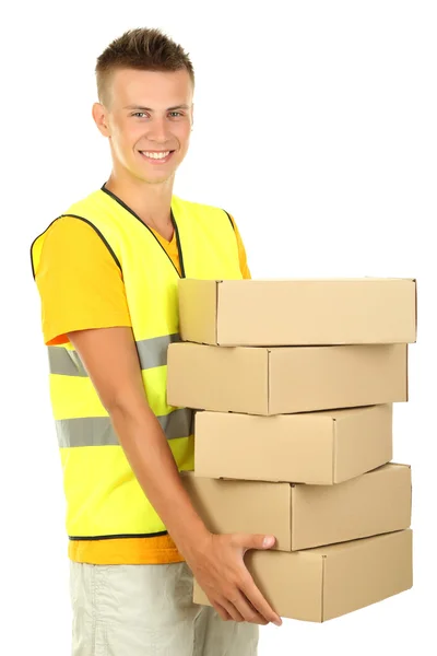 Young delivery man holding parcels, isolated on white — Stock Photo, Image