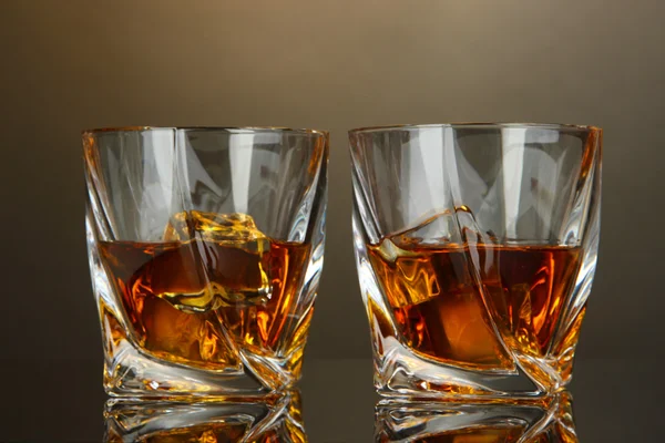 Glasses of whiskey, on dark background — Stock Photo, Image