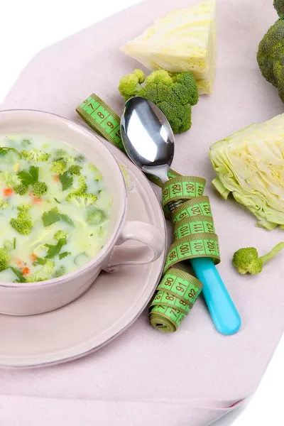 Cabbage soup in plate on napkin — Stock Photo, Image