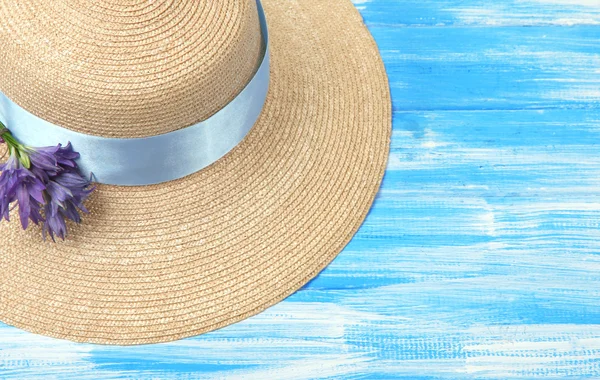 Beautiful summer hat on blue wooden background — Stock Photo, Image