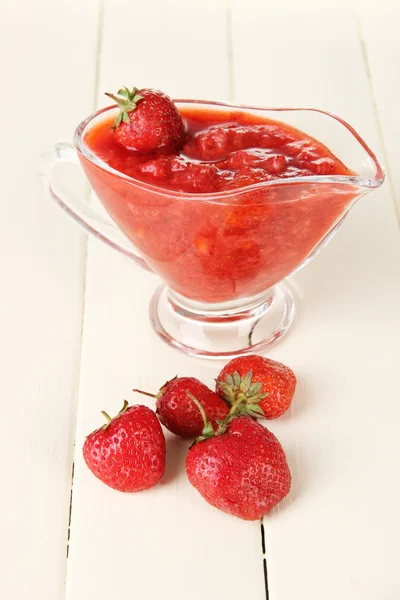 Homemade strawberry jam, on color wooden background — Stock Photo, Image