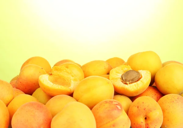 stock image Fresh natural apricot on green background