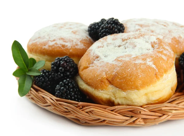 Smakelijke donuts met bessen, geïsoleerd op wit — Stockfoto