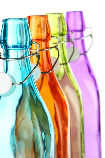 Красочные бутылки изолированы на белом — стоковое фото