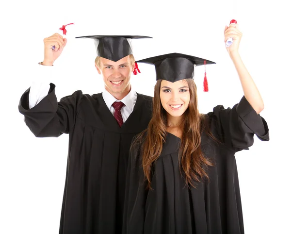 Two happy graduating students isolated on white Royalty Free Stock Photos
