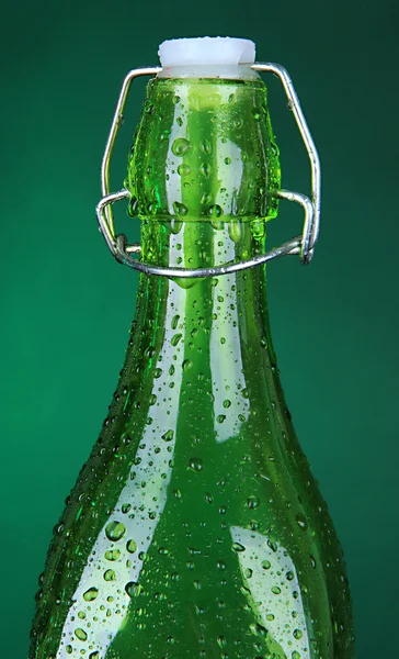 Colorful bottle on dark green background Stock Photo