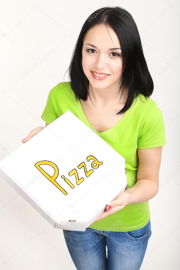 Beautiful girl with pizza in pizza box isolated on white