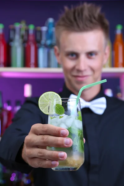 Portrait of handsome barman with mojito cocktail cocktail, at bar — Stock Photo, Image