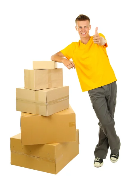 Young delivery man with parcels, isolated on white — Stock Photo, Image