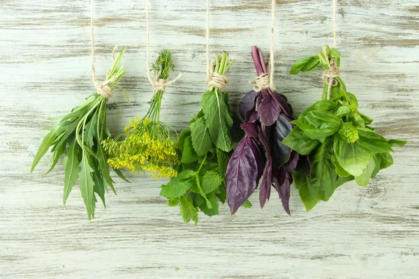 Fresh herbs on wooden background — Stock Photo, Image