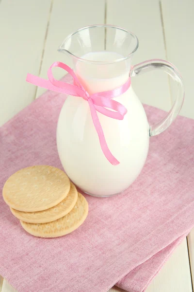 Pitcher of milk on table in room