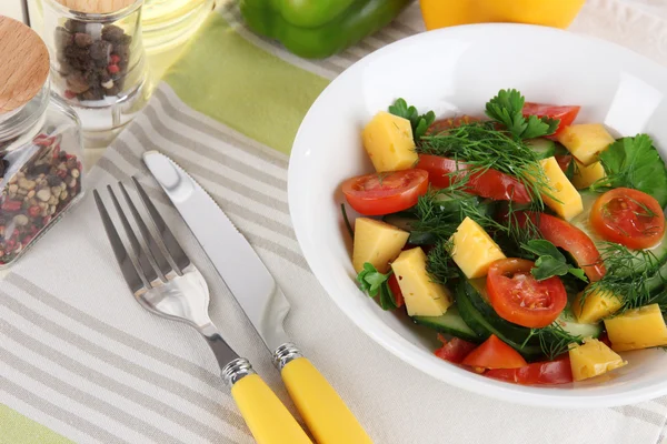 Light salad in plate on wooden table — Stock Photo, Image