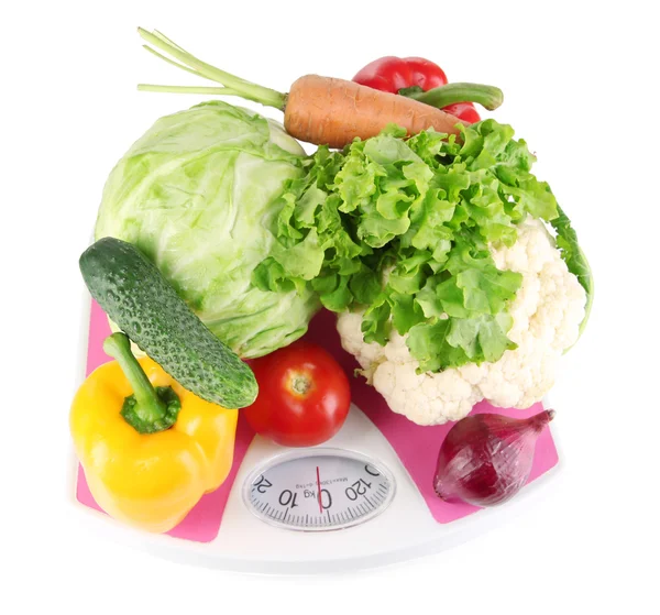 Fresh vegetables on scales on grey background — Stock Photo, Image