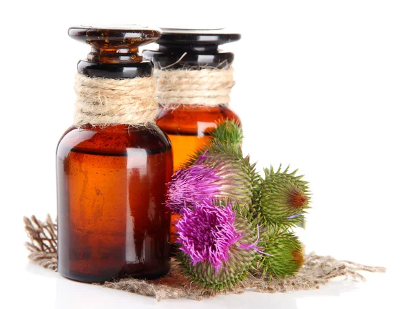 Medicine bottles with thistle flowers, isolated on white — Stock Photo, Image