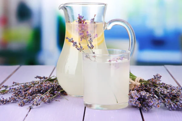 Lavender lemonade, on violet wooden table, on bright background — Stock Photo, Image