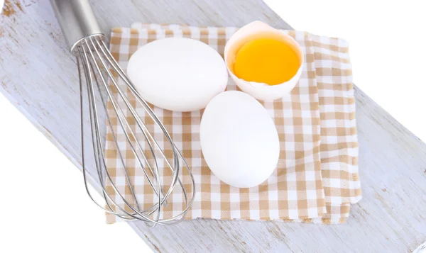 Corolla and eggs on wooden board isolated on white — Stock Photo, Image