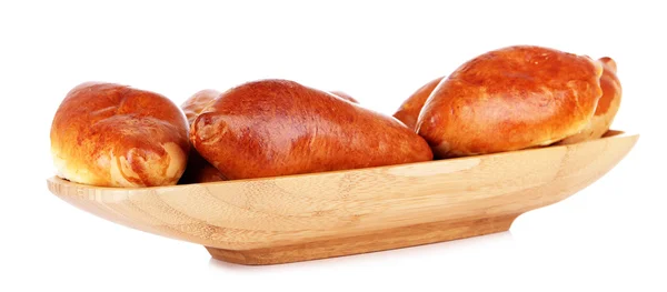 Fresh baked pasties in wooden bowl, isolated on white — Stock Photo, Image