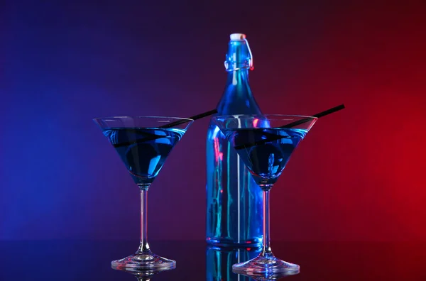 Glasses of cocktails on bright background — Stock Photo, Image