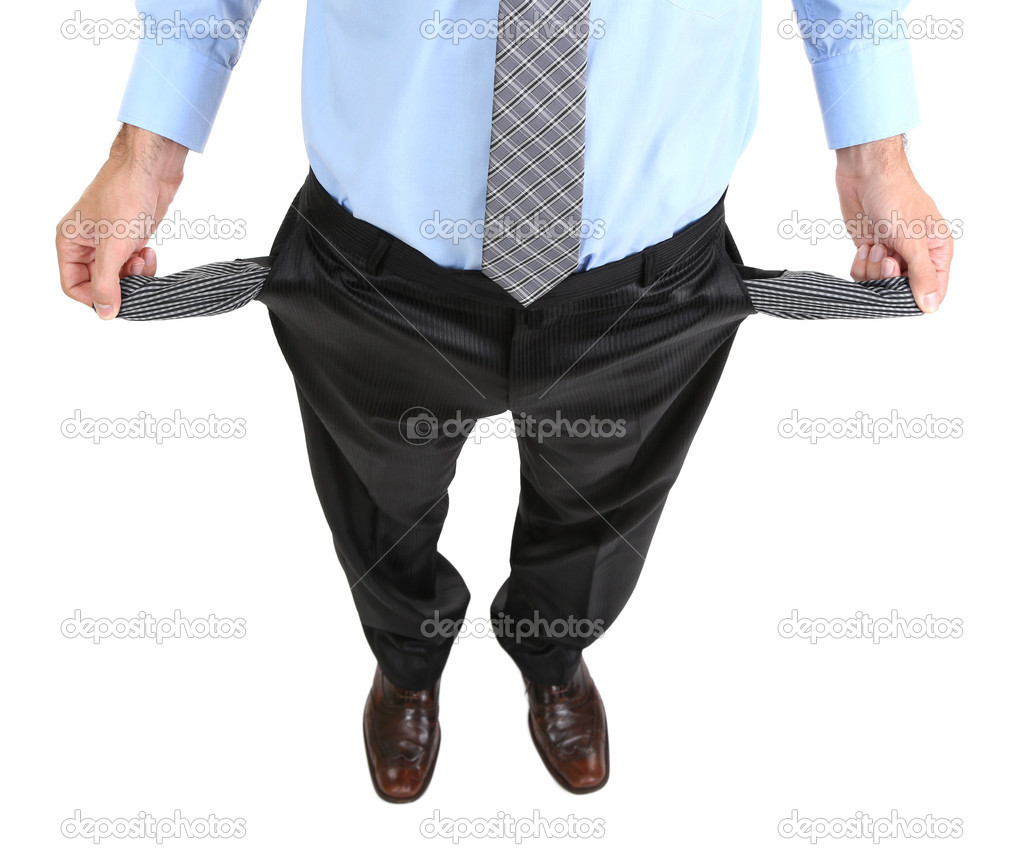Business man showing his empty pockets, isolated on white