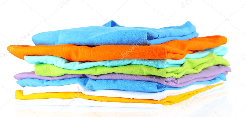 Neatly folded shirts isolated on white