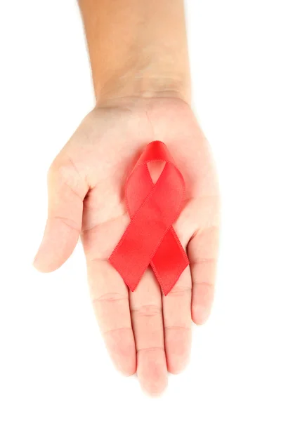 AIDS ribbon in hand isolated on white — Stock Photo, Image