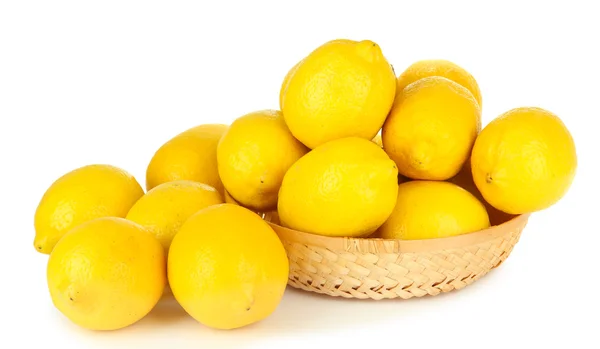 Ripe lemons in wicker basket isolated on white — Stock Photo, Image