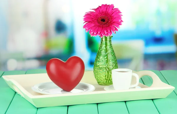 Wooden tray with breakfast, on color wooden table, on bright background — Stock Photo, Image