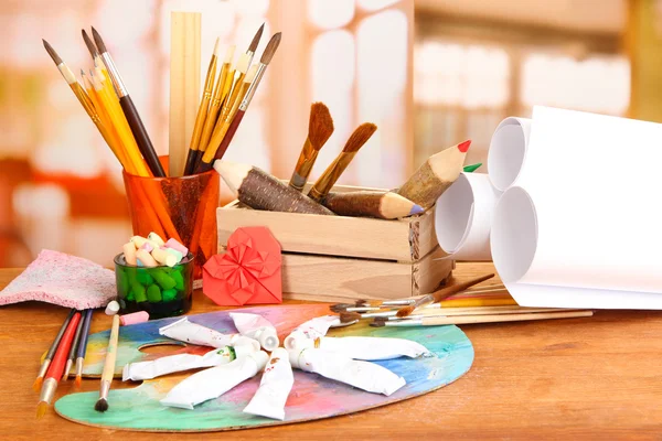 Artistic equipment: paint, brushes and art palette — Stock Photo, Image