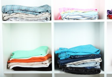 Clothes neatly folded on shelves