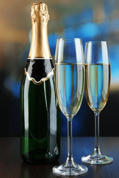 Champagne bottle with glasses on table in restaurant — Stock Photo, Image