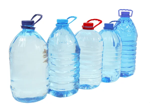 Vatten i stora flaskor isolerad på vit — Stockfoto