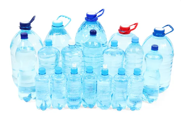 Water in different bottles isolated on white — Stock Photo, Image